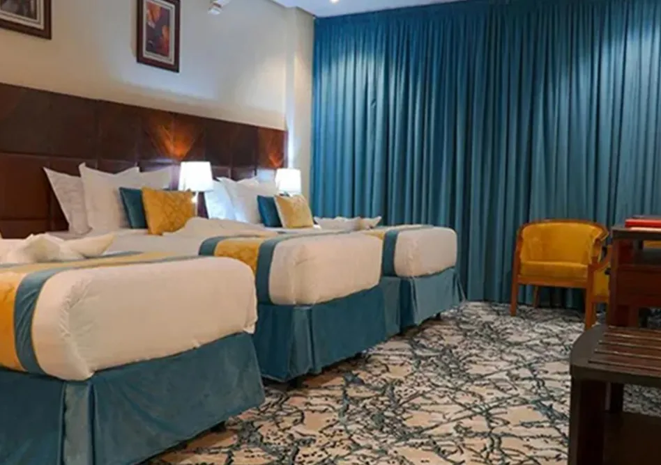 /media/umrah-images/3-single-beds-room%20%281%29.webp