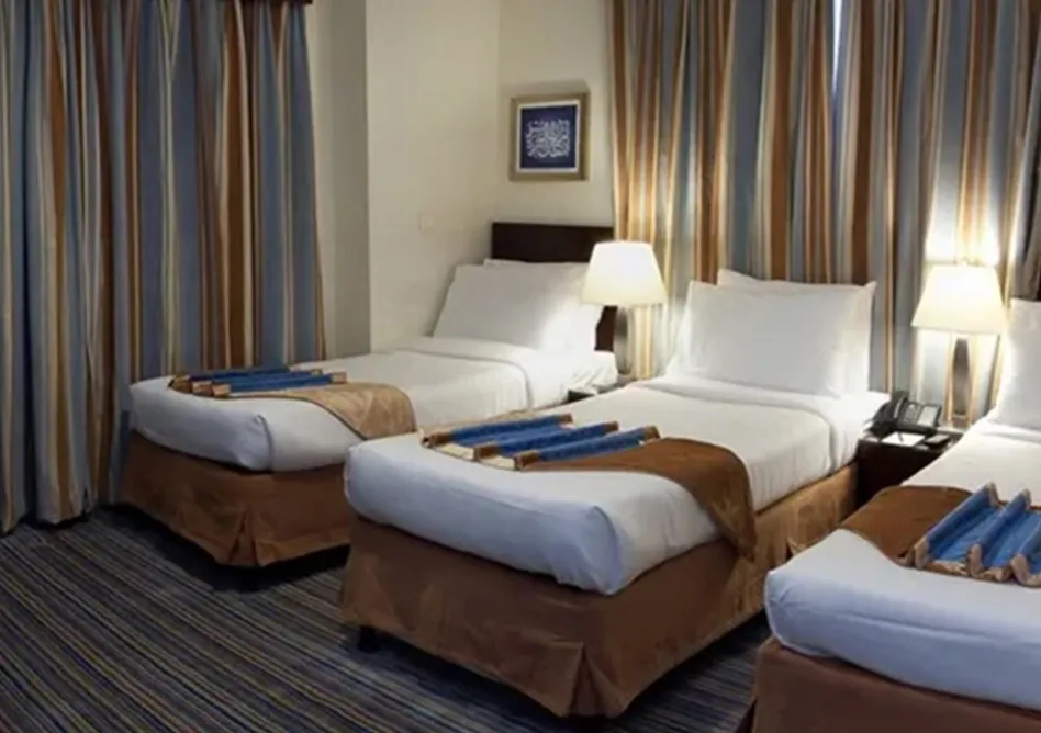 /media/umrah-images/3-single-beds-room%20%282%29.webp