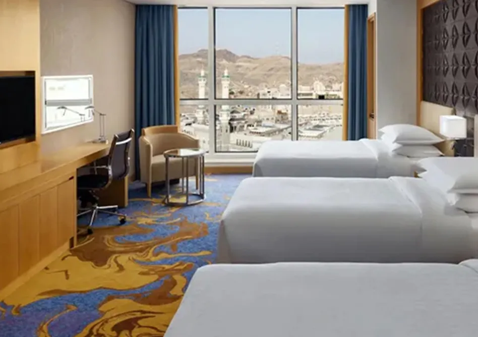 /media/umrah-images/3-single-beds-room%20%285%29.webp