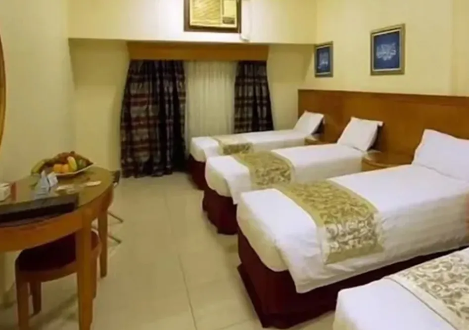 /media/umrah-images/4-single-beds-room%20%282%29.webp
