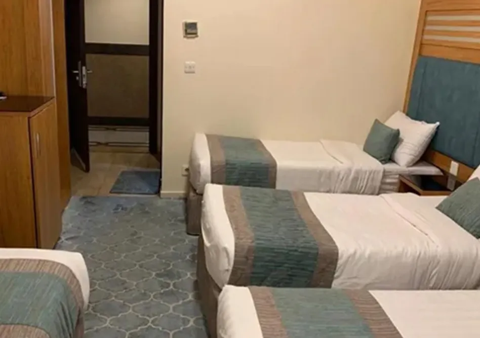 /media/umrah-images/room-with-4-single-beds%20%282%29.webp